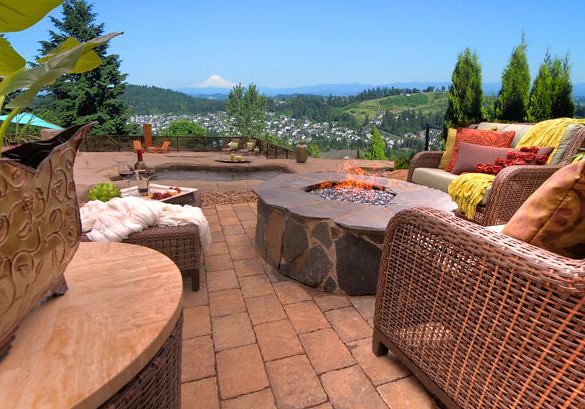Paver patio with a natural fieldstone fire pit and seating